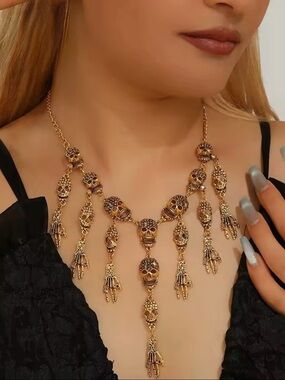 Gold-Tone Skull Fringe Necklace with Dark Accents